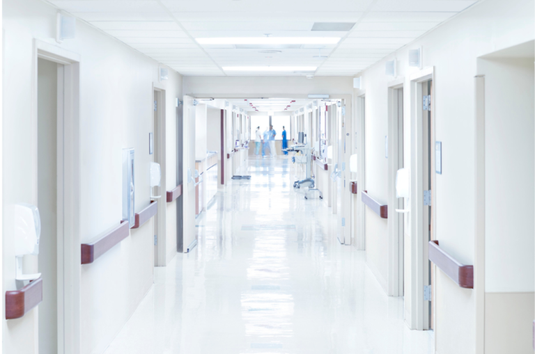 White hospital hallway with epoxy flooring