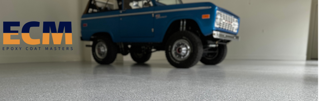 Blue Bronco parked on a decorative flake-coated garage floor with ECM logo