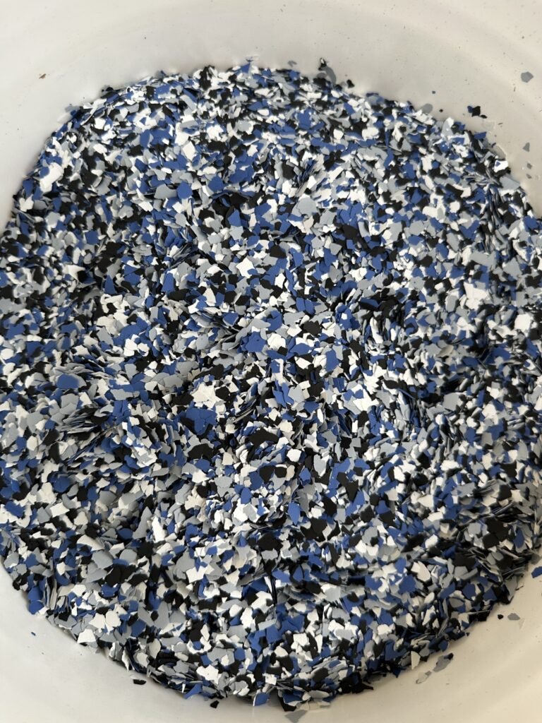 Orbit or Dream Blue epoxy floor flake blend in bucket