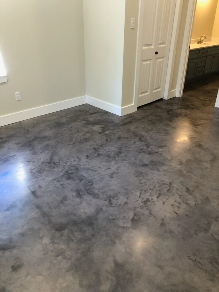 Polished concrete floor with epoxy coating in a modern home interior.