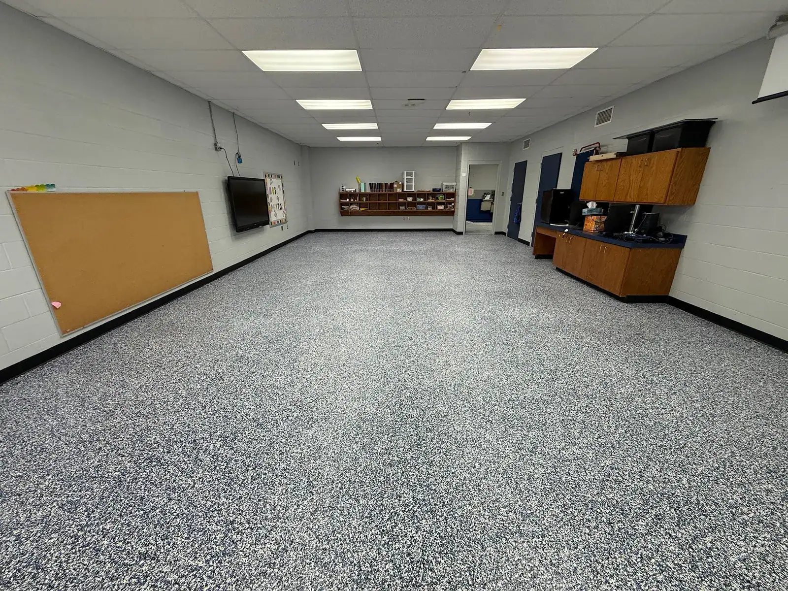 Finished school classroom floor with a custom decorative flake blend