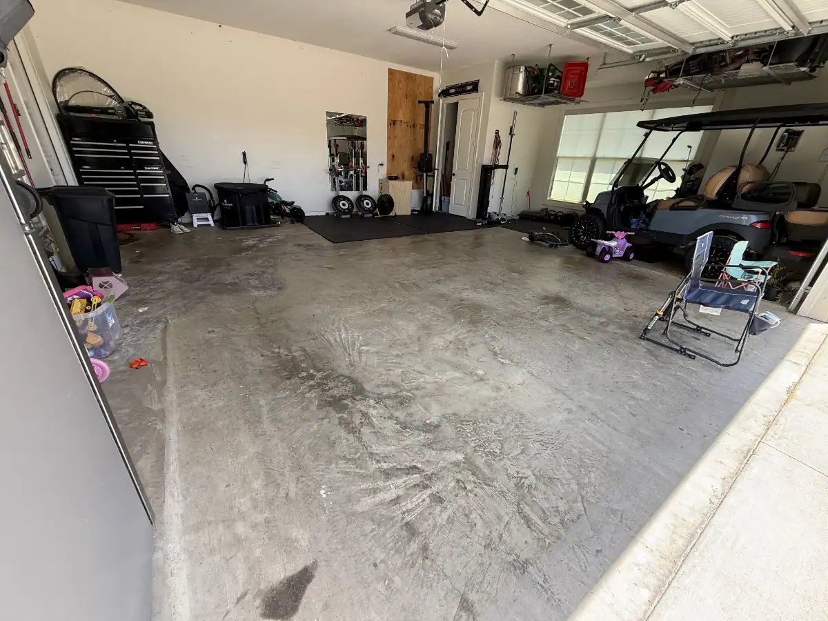 Bare concrete garage floor before a Thunder flake coating in Hideaway, Texas