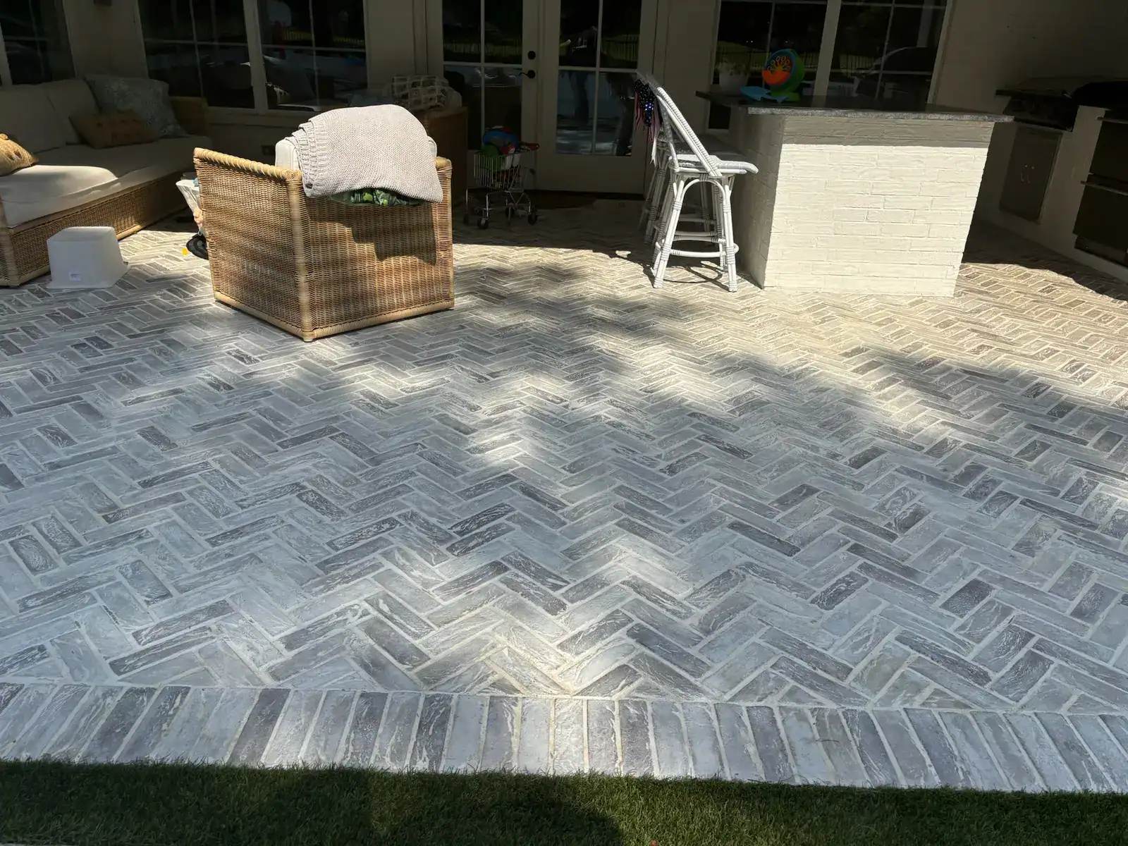 Wide view of resealed poolside brick patio in Hideaway, Texas