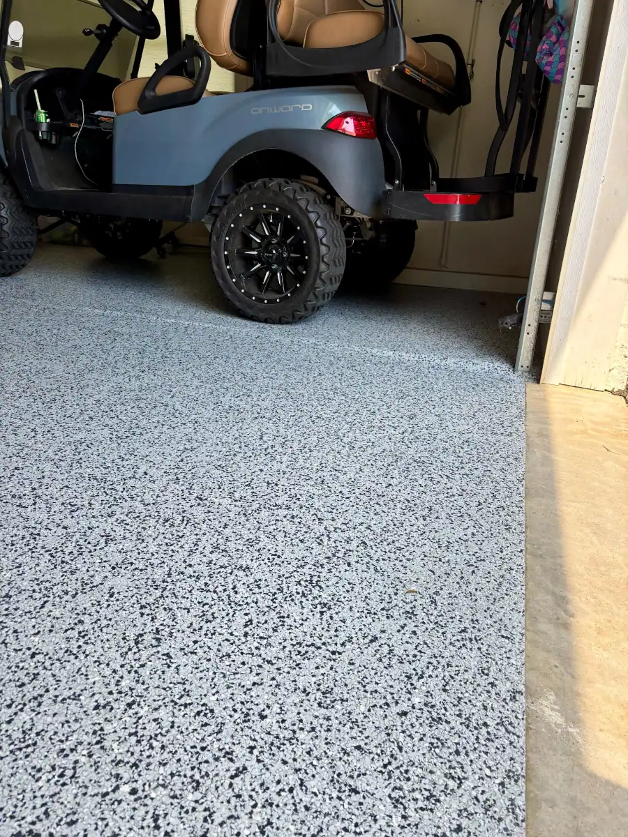 Golf cart parked on a finished Thunder flake garage floor in Hideaway