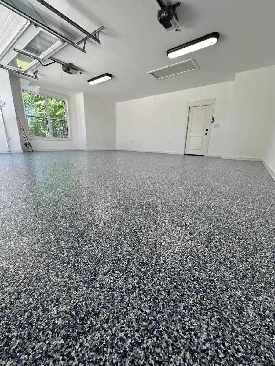 Finished Orbit Dream Blue full-broadcast flake garage floor in Lindale, Texas
